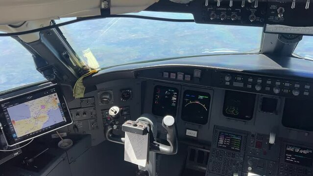 Inside a modern jet cockpit: an  unique perspective from the Captain’s seat during a real flight, cruise level 12000m high. Bombardier CRK series.