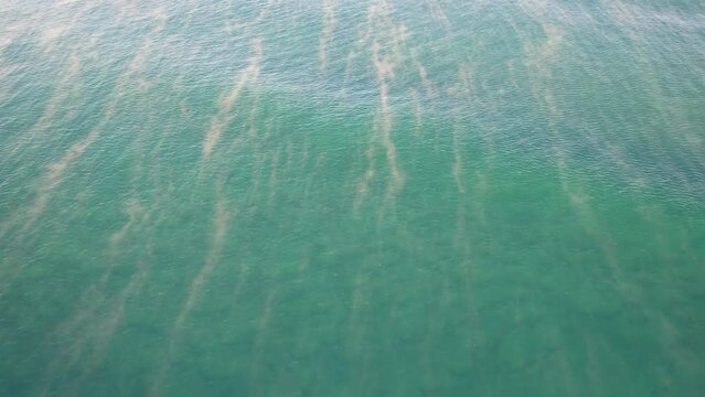 Morning Mist Above The Sea At The Coolum Beach In Queensland, Australia. aerial pullback tilt-up