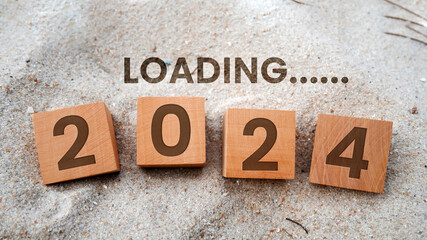 2024 New Year Loading. Loading bar with wooden blocks 2024 on blue background. Start the new year 2024 with a goal plan, goal concept, action plan, strategy, and new year business vision.