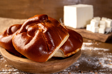 Delicious Romanian traditional sweet cheese pastries – Branzoaice. Fresh baked traditional east european pastry dessert (romanian, hungarian, bulgarian, moldovian), homemade sweet or salty cheese pie.