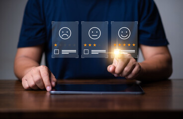 Customer rating and satisfaction concept, Man using tablet and tick a checkbox for give five star symbol to increase rating of product and service concept.