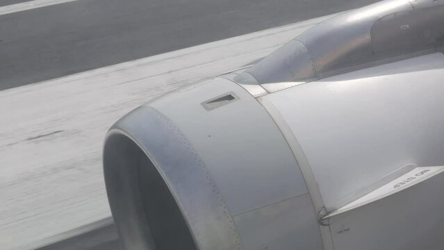 View from in side plane cabin through plane window see plane's engine