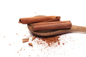 Cinnamon sticks, pieces with shavings isolated on white 