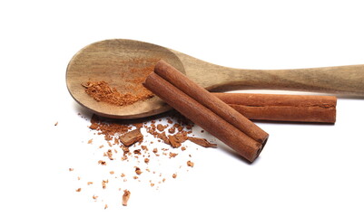 Cinnamon sticks, pieces with shavings isolated on white 