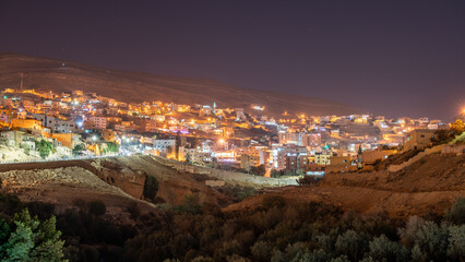 night scape view of wadi musa city near petra jordan