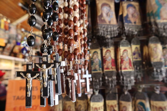 Close Up Rosary Beads And Souvenirs For Sale In Market