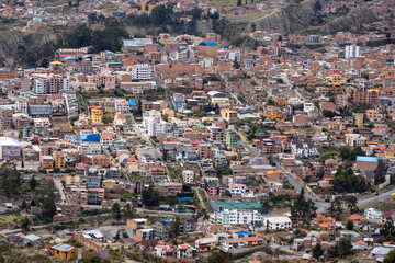 Fototapeta na wymiar View from the scenic road to the landmark Muela del Diablo over the highest administrative capital, the city La Paz and El Alto in Bolivia - close up of hundreds of houses