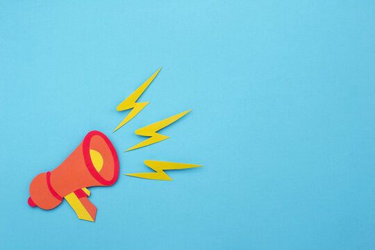 Loudspeaker announcing promotions on blue background made of paper cut. creative design with space for text. - Powered by Adobe