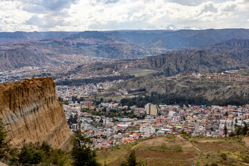 View from the scenic road to the landmark Muela del Diablo over the highest administrative capital, the city La Paz and El Alto in Bolivia