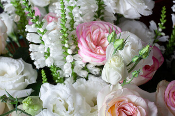 Rose flower bouquet close up. Background of white and pink roses.