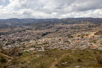 View from the scenic road to the landmark Muela del Diablo over the highest administrative capital, the city La Paz and El Alto in Bolivia