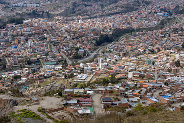 View from the scenic road to the landmark Muela del Diablo over the highest administrative capital, the city La Paz and El Alto in Bolivia - close up of hundreds of houses of La Paz