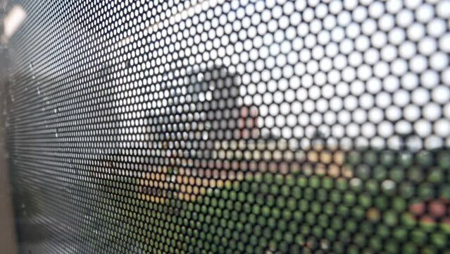 view through out the train window while operating pass through the mega city center of Bangkok in daytime, metropolis public transportation
