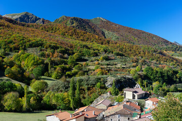 Fototapeta na wymiar Picos de Europa National park with the village of Santa Marina placed in the Valdeon valley in autumn