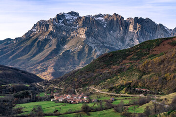 Fototapeta na wymiar Western massif of the Picos de Europa National park and the village of Santa Marina placed in the Valdeon valley at sunrise, Leon, Spain.