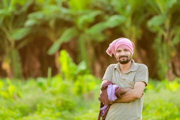 Naklejka na ściany i meble Indian Cwopea farming. farmer holding Cwopea in hands , happy farmer