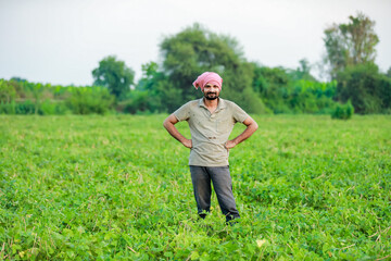 Naklejka na ściany i meble Maharashtra look farmer, happy farmer standing in Cwopea farm