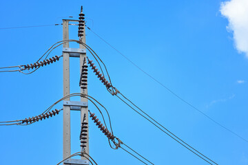 High voltage electric pole with sky background. Electricity concept is essential with modern...