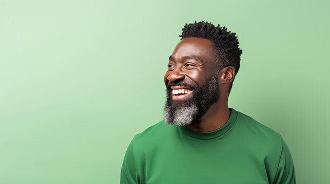 Nigerian man in 40s, black hair, green color theme