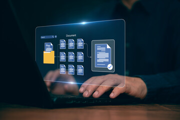 Document Management and Networking Concepts Businessman using laptop to load documents in online document Document management, storage and technology to process paperless digital documents.