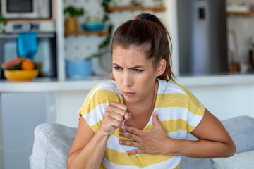 Breathing, respiratory problem, asthma attack, pressure, chest pain, sun stroke, dizziness concept. portrait of woman received heatstroke in hot summer weather, touching her forehead