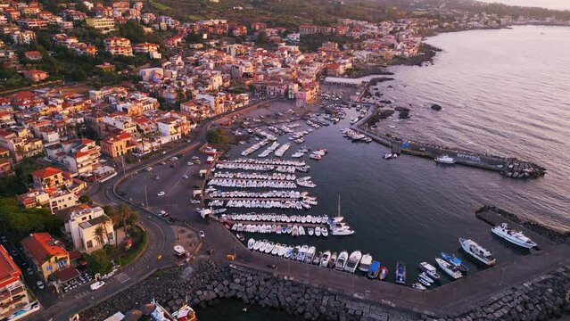 Aerial view of Aci Trezza, a seaside village in the countryside near Catania in Sicily.
Traditional harbor on the cliff overlooking the stacks of the mythologyIslands of Greek mythology of Polyphemus.