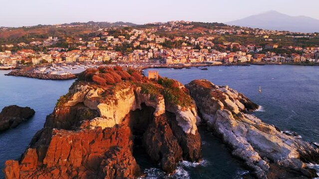 Aerial view of Aci Trezza, a seaside village in the countryside near Catania in Sicily.
Traditional harbor on the cliff overlooking the stacks of the mythologyIslands of Greek mythology of Polyphemus.