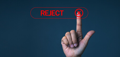 Hand touching the red REJECTED button on a dark background means refusing to accept the request,...