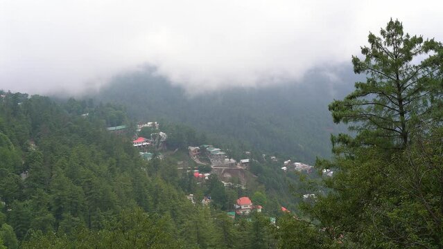 Clouds in the mountains. Cloud moving between green hills in Murree, Pakistan. Cloud formation in mountainous area, in humid environment after rain.