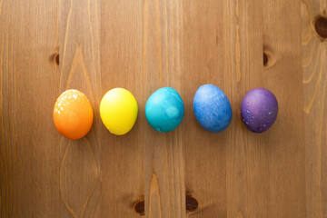 Colorful easter eggs on wooden background.