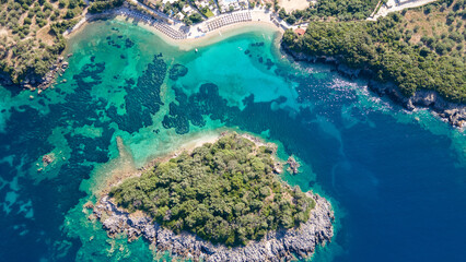 Aerial view of Luxury resort with swimming pools on a palm fringed beach, aerial view, Greece, Epirus. 