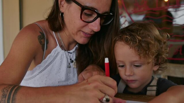 A mom draws with her son