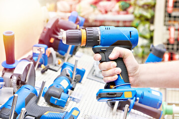 Electric screwdriver in hand