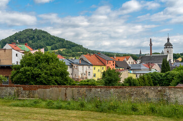 Ruins of Castle Kamenice and the town of Ceska Kamenice in Czech Republic seen from the park