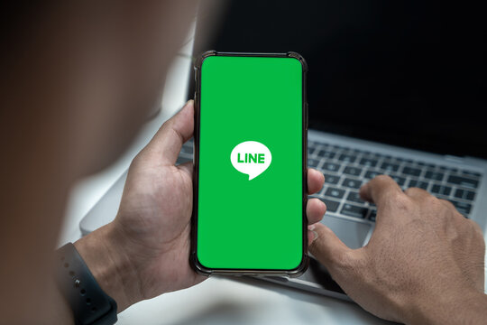 Closed up image of a male using line application on a smartphone in home. 20 july, 2023. Chiang Mai, Thailand.