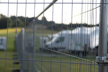 Temporary metal fence installed at Cowdray, July 2023