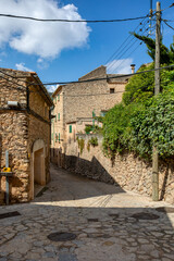 Fototapeta na wymiar Narrow streets in historic center of town of Valldemossa, Balearic Islands Mallorca Spain.