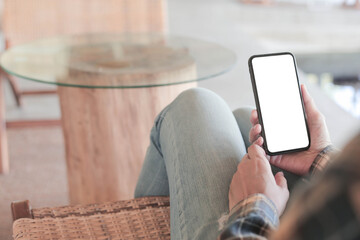 cell phone blank white screen mockup.hand holding texting using mobile on desk at office.background empty space for advertise.work people contact marketing business,technology