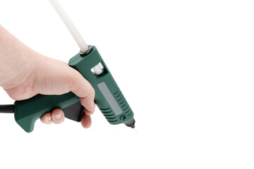 Glue gun on a white background. Electric glue gun close-up on a white background