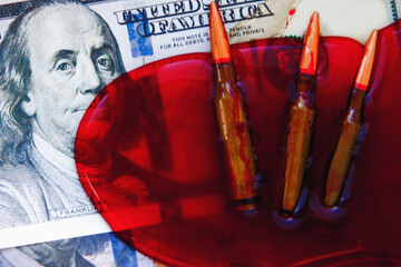 Bullets on dollar bills as symbol of russia's war against the Ukrainian people and the democratic...