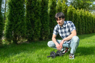 Man working out in park seated on grass