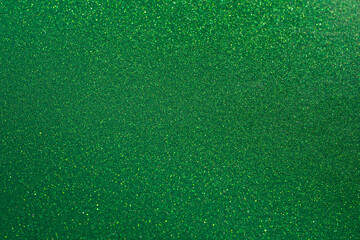 Glittering bright background of green texture. Abstract