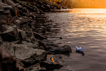 

paper boat on the river