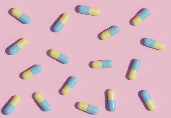 Pastel color Medicine Pills. Yellow and Blue Pills flying down out of container. 3D Rendering. Pharmacy concept. Drugs awareness.