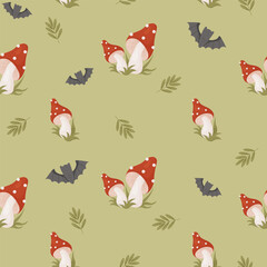 Seamless pattern with poisonous fly agaric mushrooms and bats on green background. Vector illustration in cartoon style for Halloween design, decor, textile, wallpaper and print.