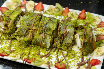 Traditional turkish dessert, sherbet dessert, traditional turkish dessert with chocolate and fruit,...