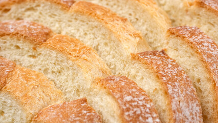 Sliced wheat bread. Texture of baked porous bread close-up