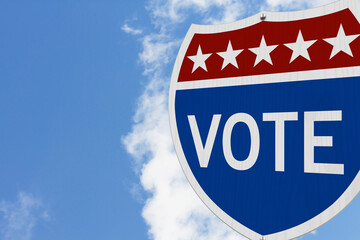 Vote message on USA highway road sign