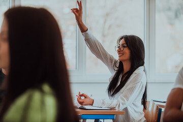 A black-haired female student wearing glasses is attentively engaged in a modern classroom, embracing education and learning with focus and curiosity