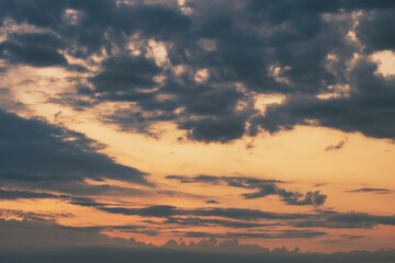 After sunset clouds with orange sky.